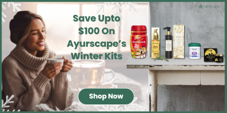 Ayurscape Winter Kit Offer  - Woman holding cup with winter ayurvedic essentials on the table